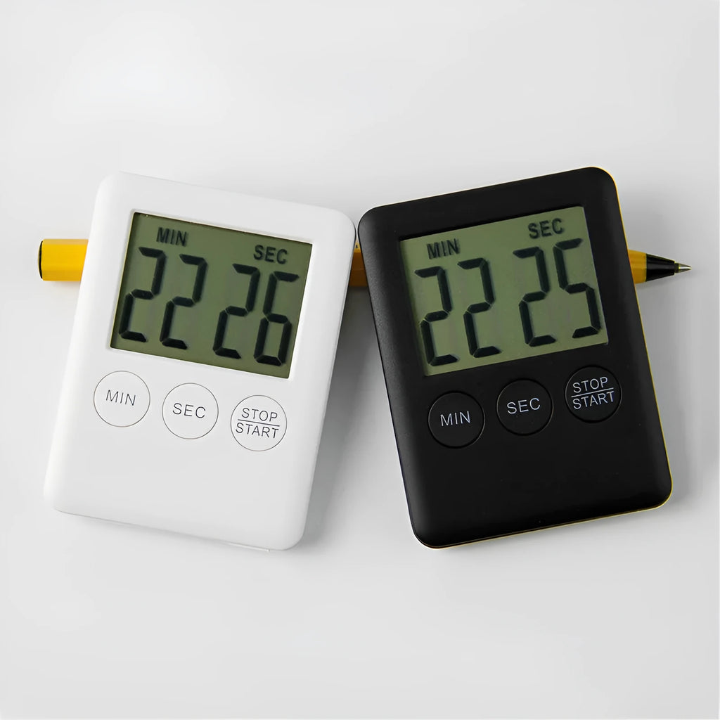 Black and white digital kitchen timer with magnetic back showing count up, countdown and alarm functions.