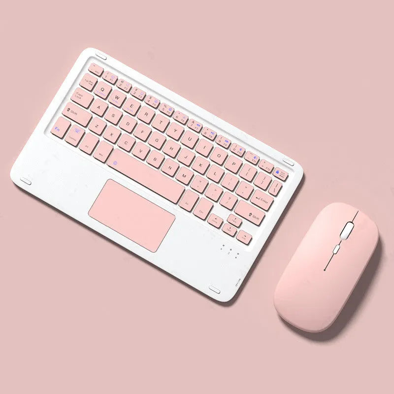 Pink wireless Bluetooth keyboard and matching dual-mode charging mouse on a desk