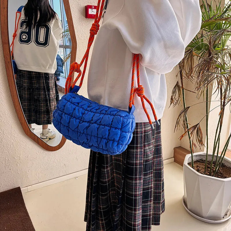 Women's lightweight nylon messenger bag in clouds print design with pillow shape and crossbody strap