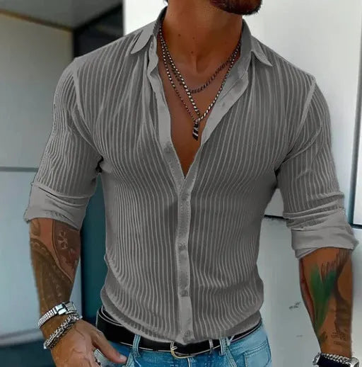 Man wearing a loose fit striped cardigan shirt in British style with a 3D pattern.