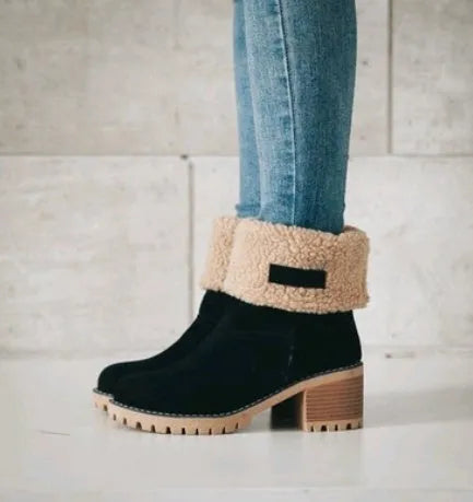 Women's mid-tube suede snow boot in black with a thick heel and round toe.