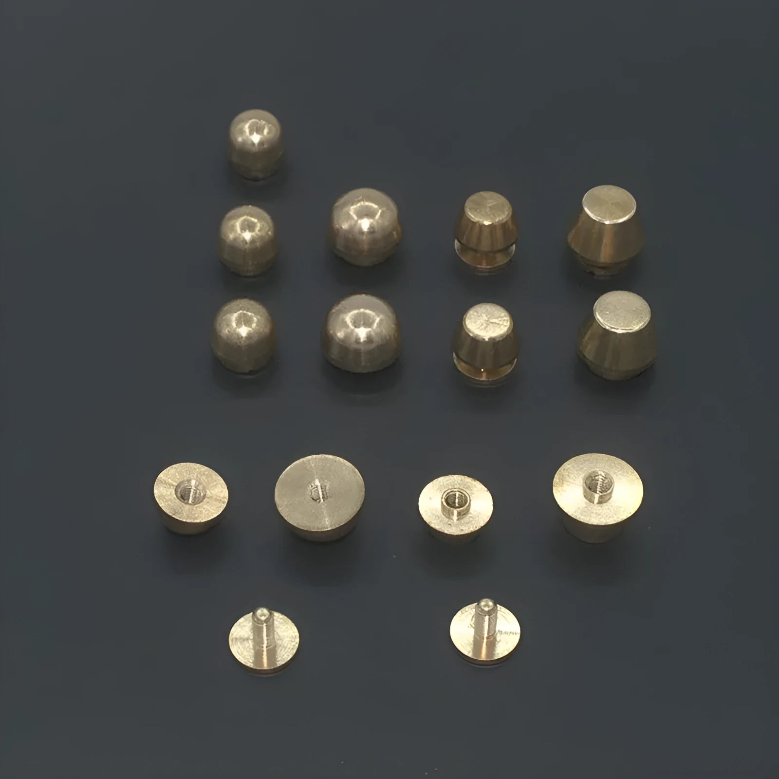 Brass decorative foot nail buckles in round and bucket shapes, sizes 10x6mm and 12x7mm.