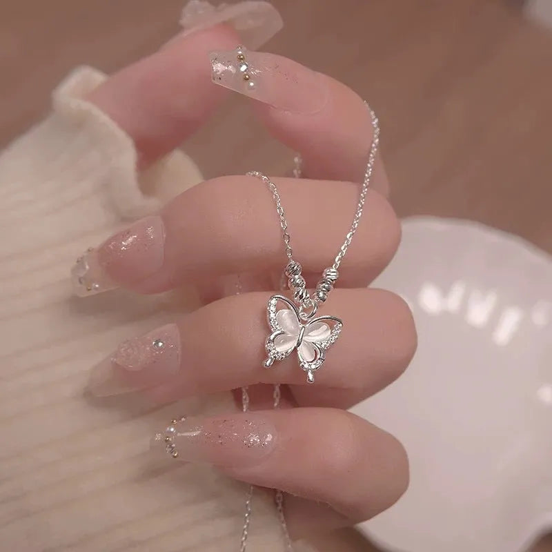 Women's square line opal butterfly necklace in 925 silver with a cross chain, shown in silver colour.
