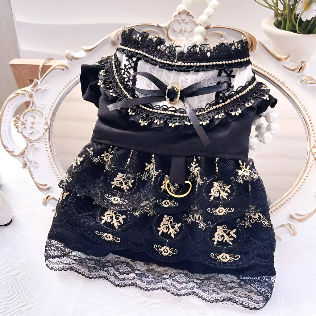 Golden Gothic princess skirt costume for a small dog on a mannequin, showing the tiered skirt design.