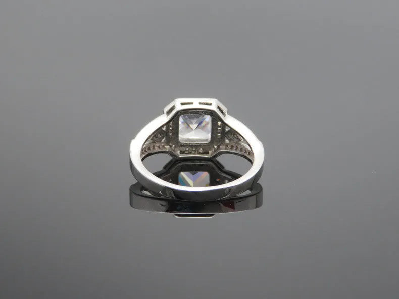 Platinum finish geometric zircon ring with hollow design and quadrilateral patterning