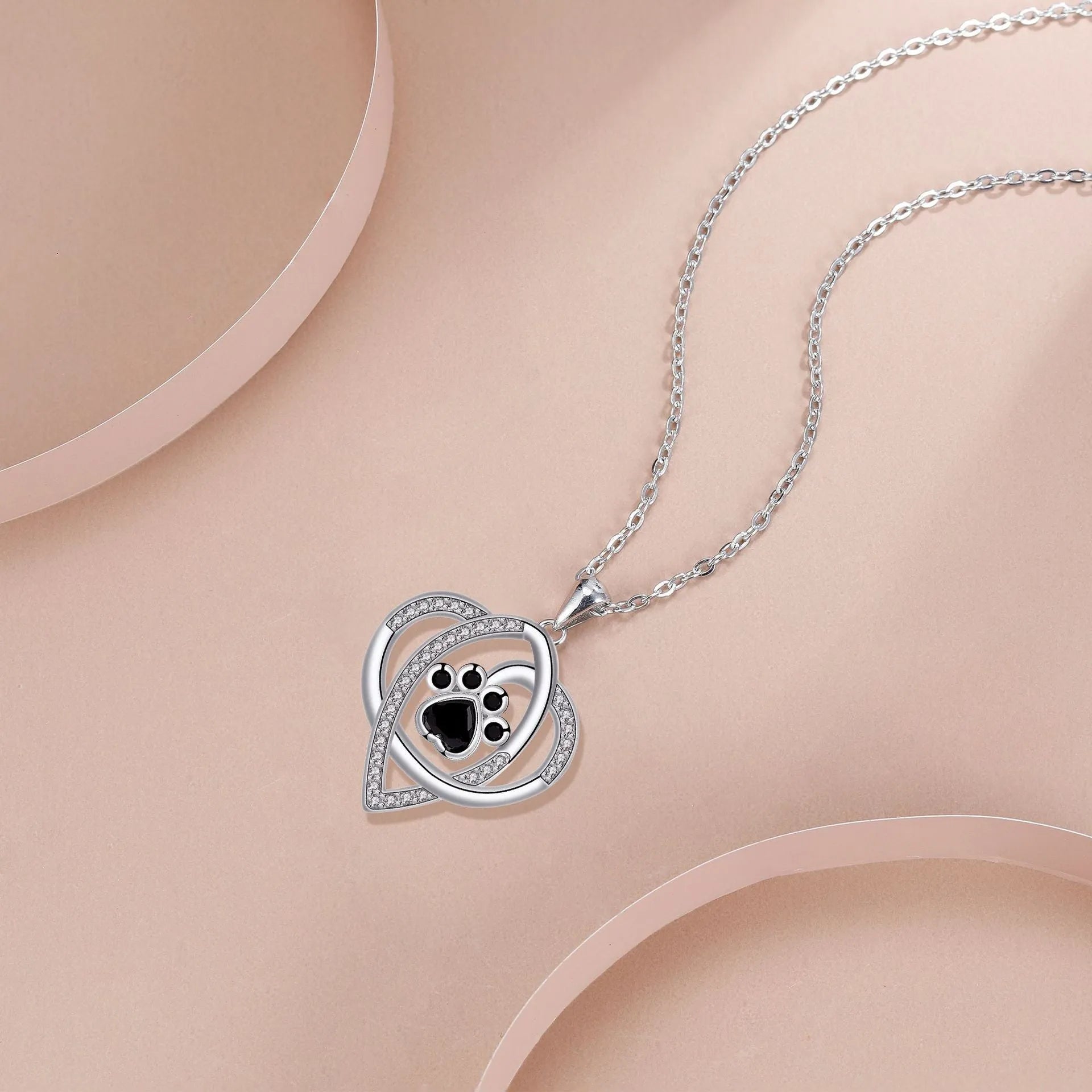 Copper necklace with dog and cat paw print pendant on cross chain with electroplated finish
