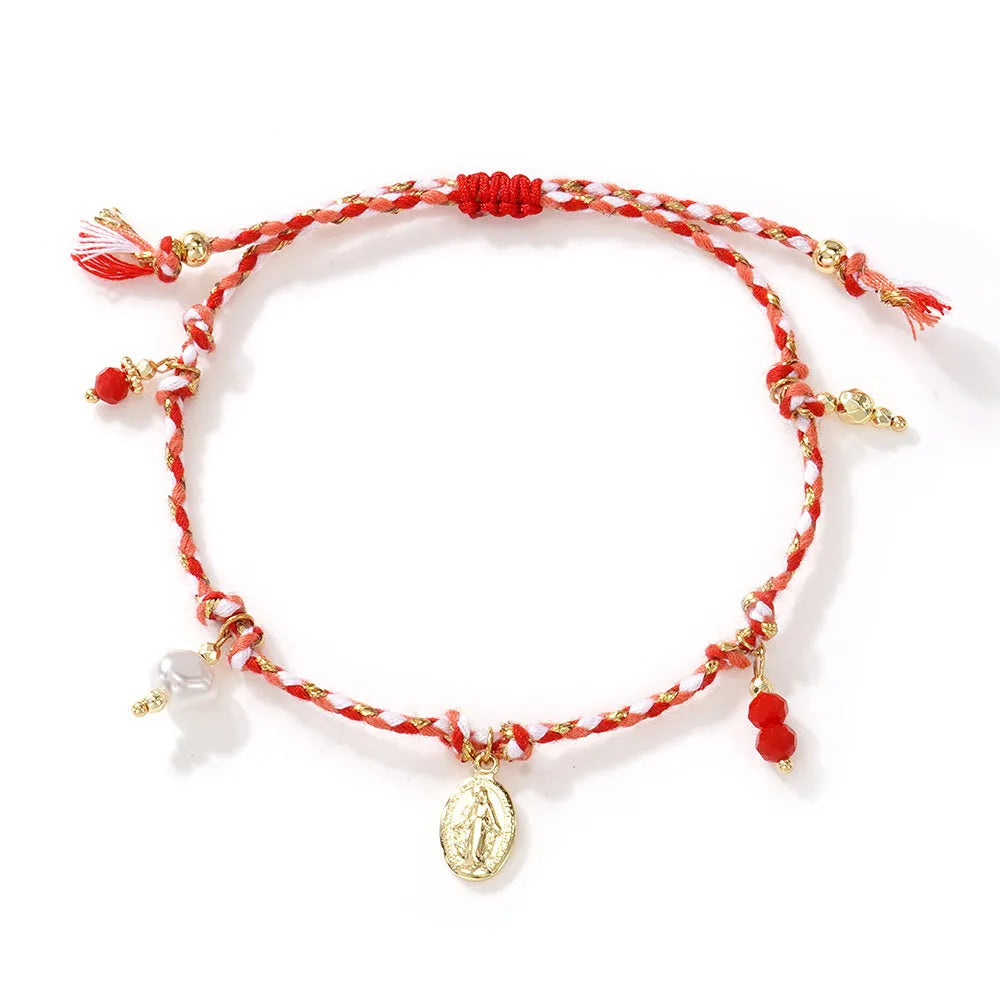 Close-up of a hand-woven colourful braided rope bracelet with an adjustable strap tag, showing ethnic style design.