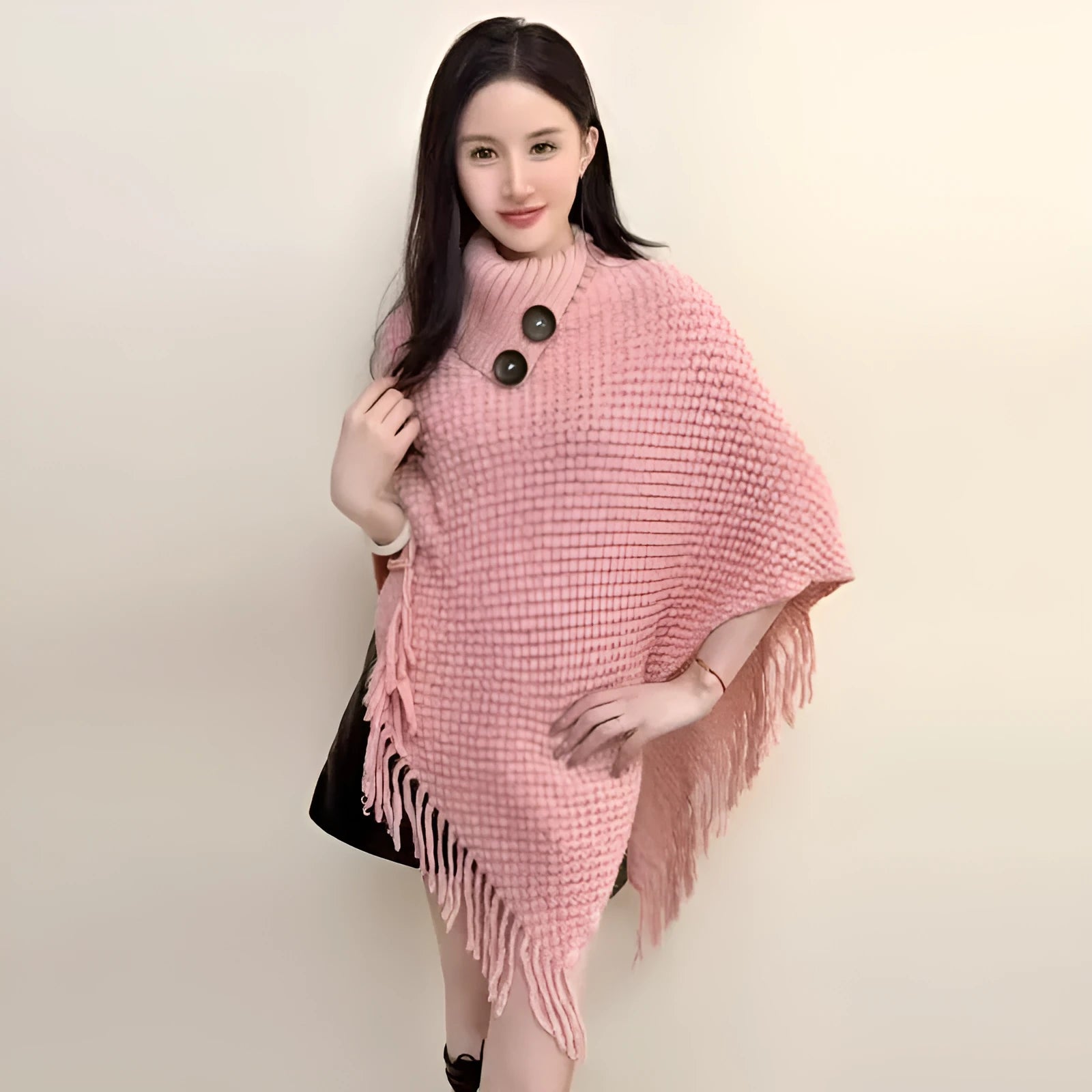 Women's triangular plush shawl cape in a cashmere blend with tassel detailing.