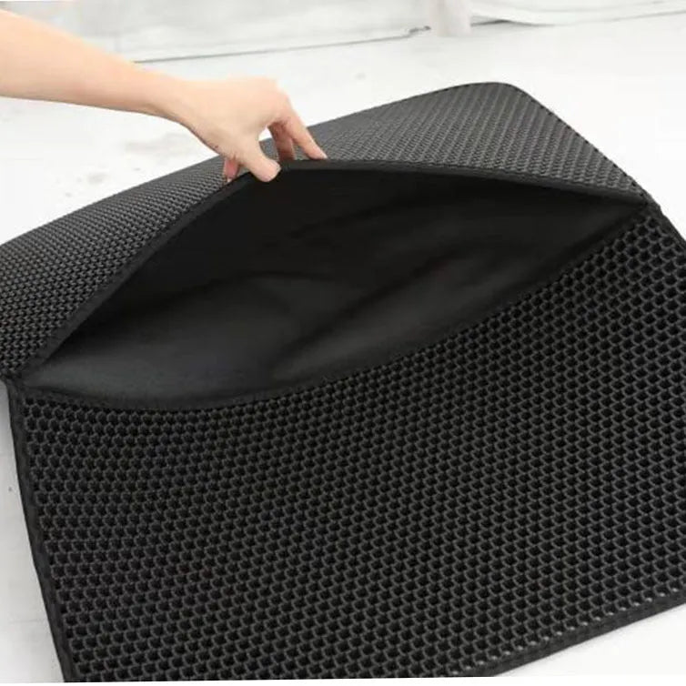 Double-layer EVA cat litter mat in black with honeycomb texture, 1.5cm thick, placed under a litter tray