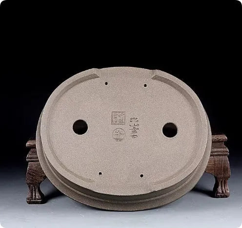 Handmade antique oval bonsai flower pot in purple sand clay, showing dimensions 25cm by 21cm.