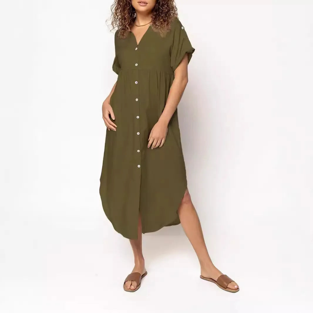 A loose-fitting, mid-length casual dress with button detail on the front, shown in a solid colour.