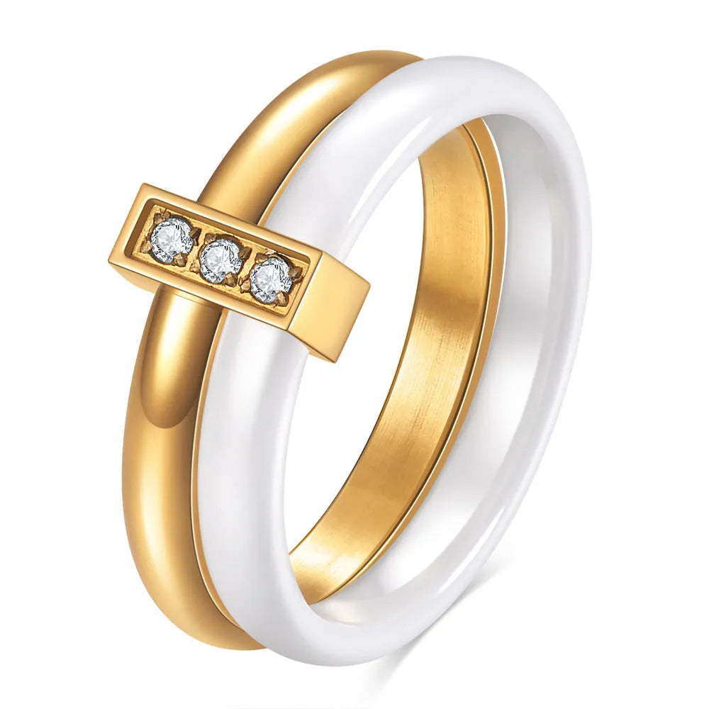 Ceramic women's ring with 6mm zirconium inlay in geometric design, available in steel black or gold white finishes