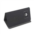 Folding wireless charging mouse pad set with Bluetooth mouse on desk, showing compact folded size