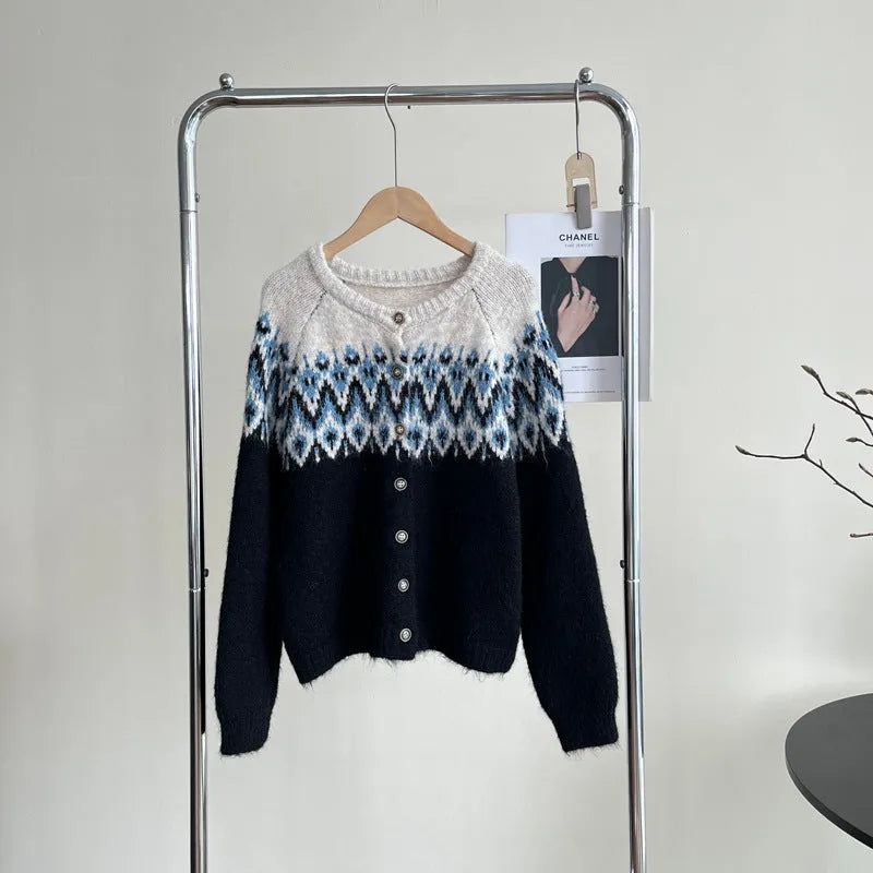 Women's beige jacquard knit sweater coat with contrast pattern, shown with long sleeves and a loose fit.