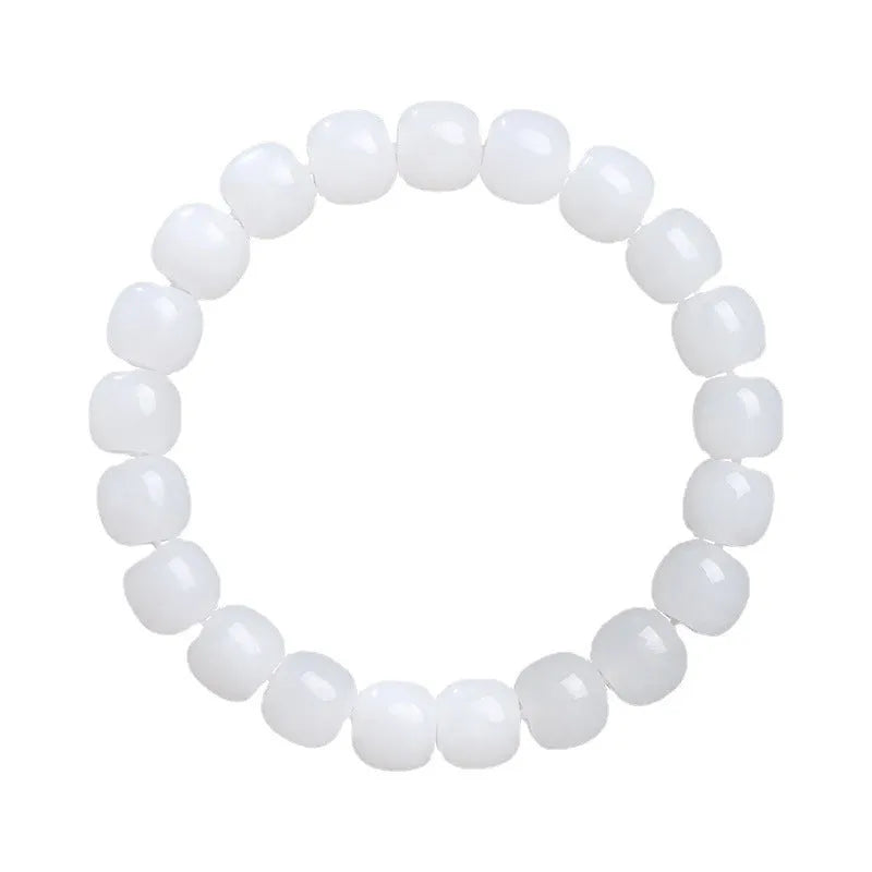 White Hetian jade barrel bead bracelet laid flat, showing unisex casual design.