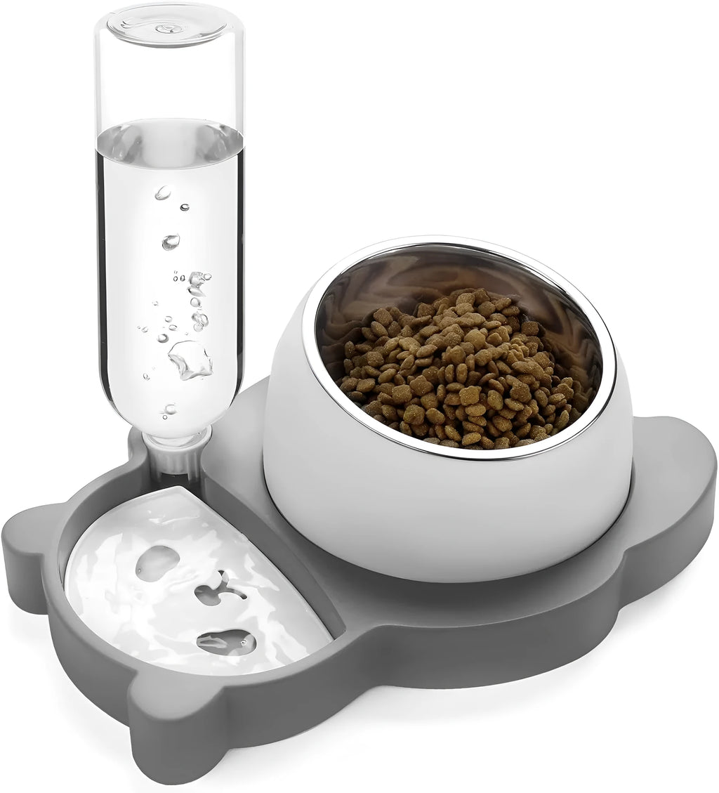 Grey panda-shaped automatic pet water dispenser and tilted food bowl set on a table.