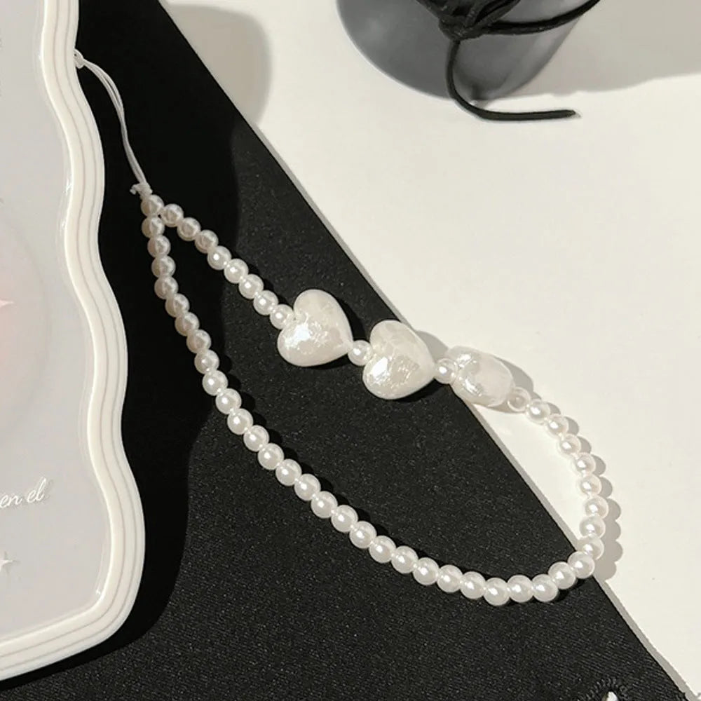 Clear transparent iPhone case with a raised 3D ice-effect bow design on the back.