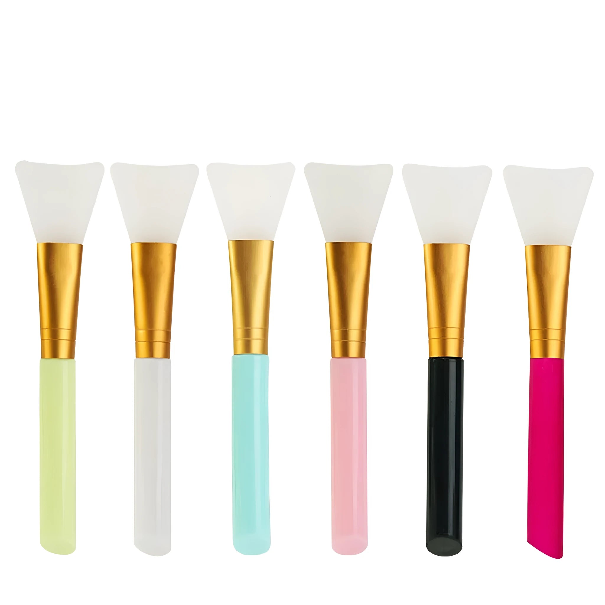 Reusable silicone face and body mask applicator spatula in assorted colours on a clean surface