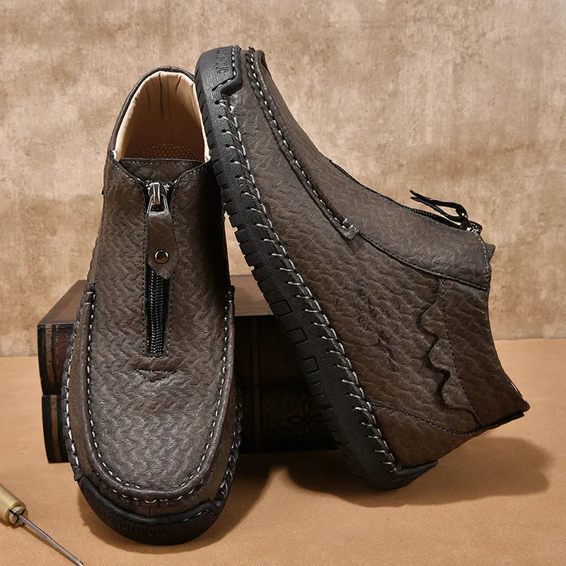Men's black slip-on casual loafers with a round toe and rubber sole, shown from the side.