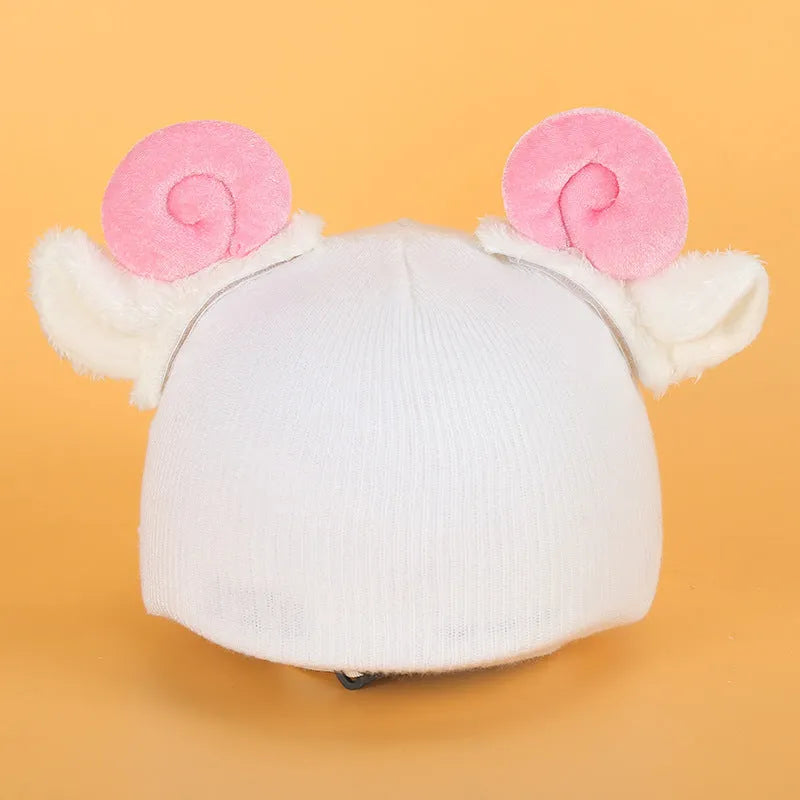 Cute plush cartoon animal character hat designed to decorate a standard ski helmet.