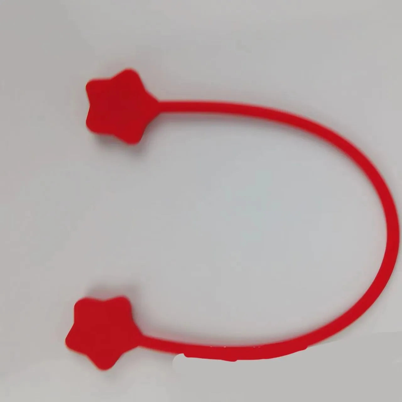 Silicone cable winder with magnet in assorted colours on a white background
