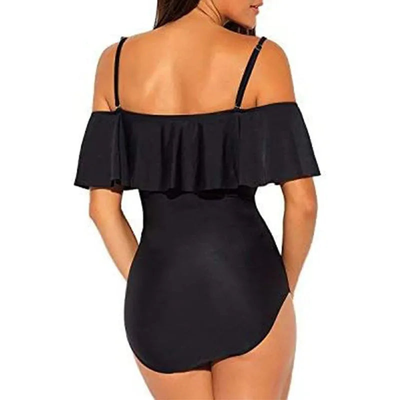 Black one-piece swimsuit with cut-out detail and ruffled straps on a mannequin.