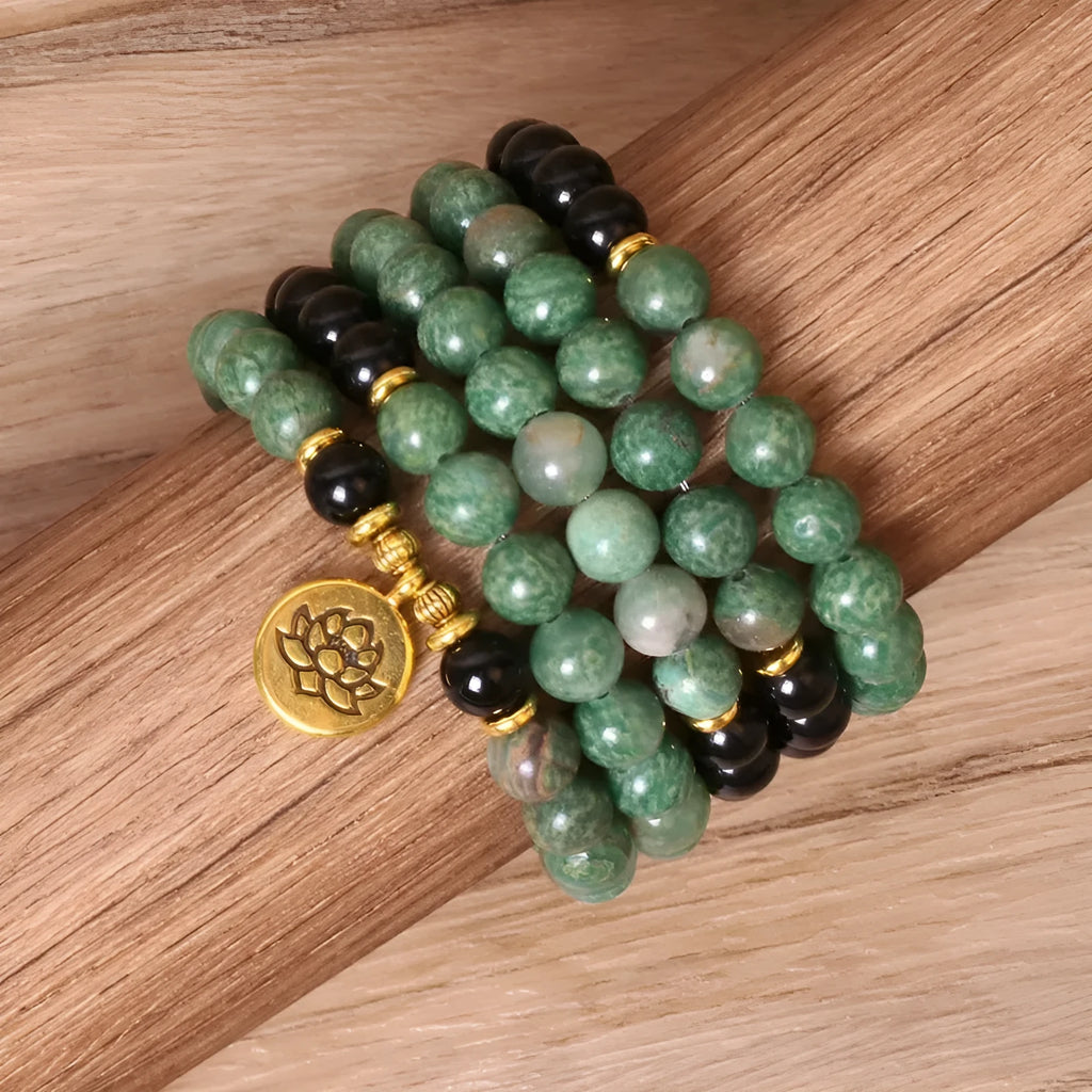 Women's green and black alloy elastic beaded bracelet on a wrist, showing natural style design.