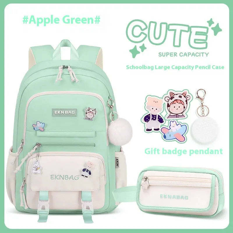 Pink waterproof Oxford cloth school backpack for girls with curved shoulder straps on a white background.