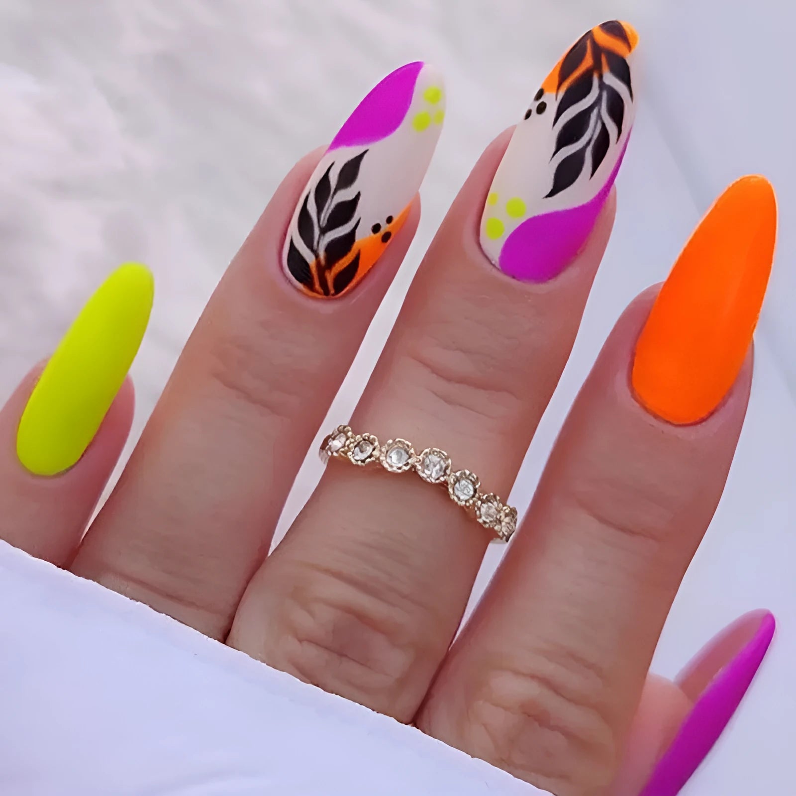 Wear Armour almond nail stickers in French leaves, leopard print, macaron and plating designs