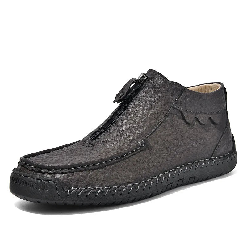 Men's black slip-on casual loafers with a round toe and rubber sole, shown from the side.