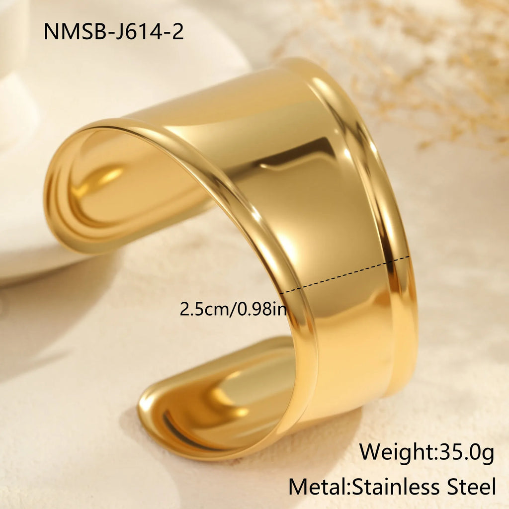 Women's wide stainless steel bracelet with 18K gold plating, geometric wave design, and niche opening closure.