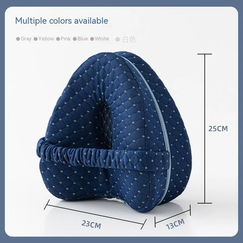 Heart-shaped dark blue memory foam leg pillow for adult knee or ankle support.