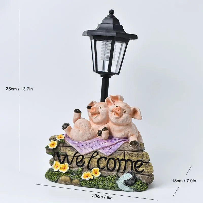 Solar hexagonal garden lamp with decorative resin figurine on plastic base for outdoor pathway lighting