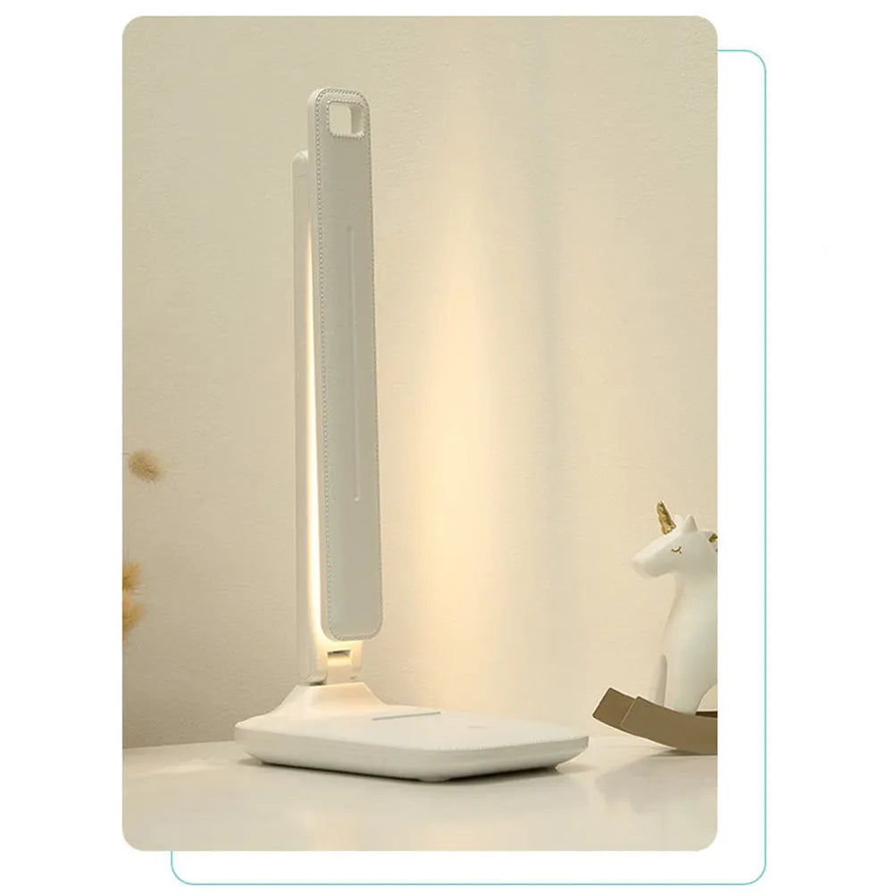 White bedside lamp with touch dimming control and USB charging port for children's bedrooms