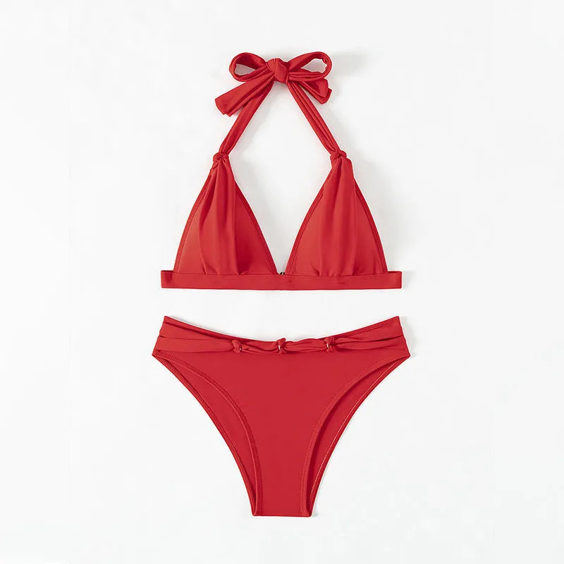 Red women's halterneck bikini with lace-up front and high-leg briefs