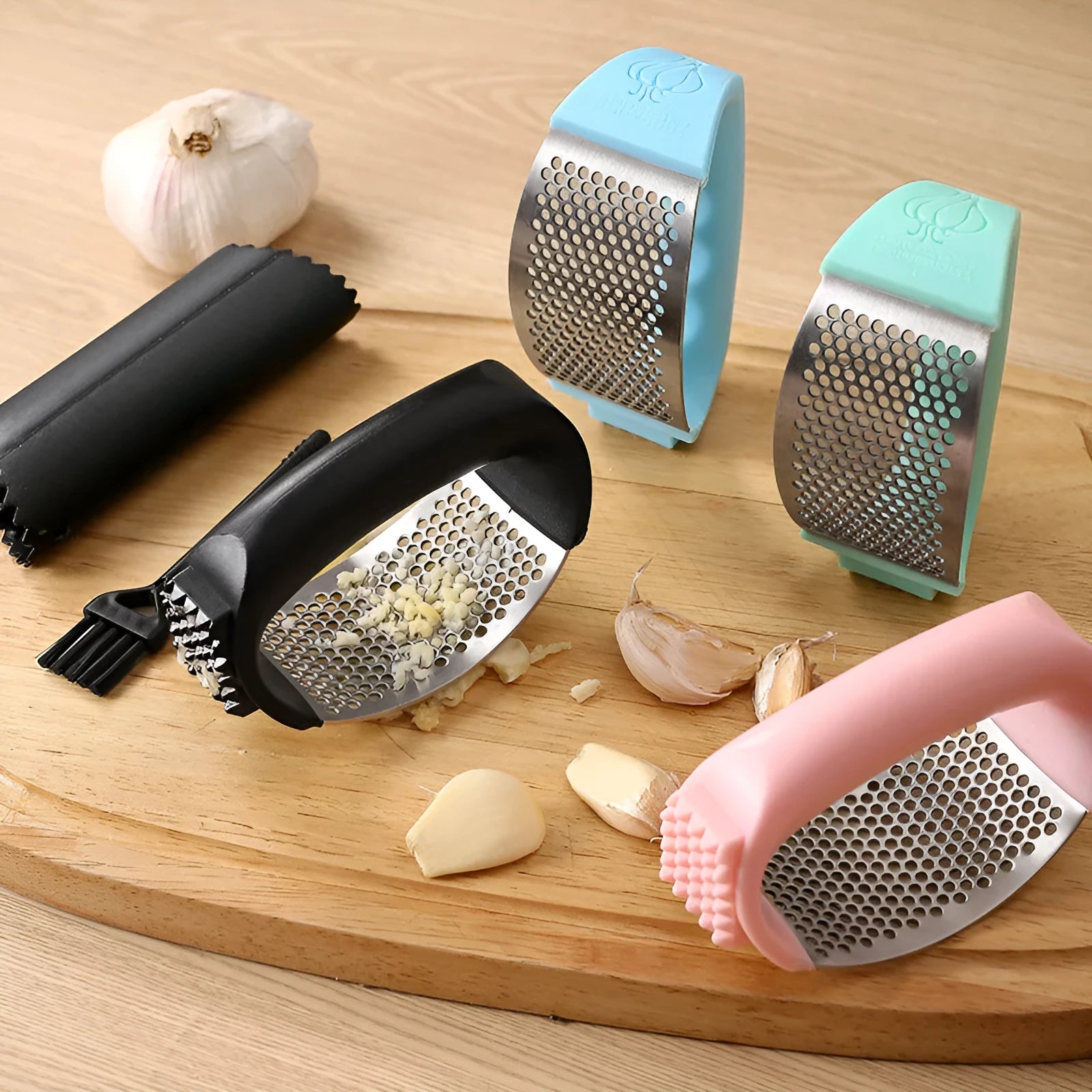 Stainless steel garlic press kitchen utensil in black, blue, green or pink colour measuring 11x7cm