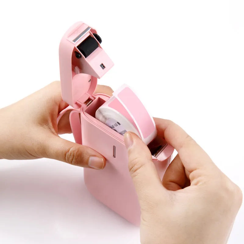 Compact D11 Bluetooth label printer in various colours, showing phone app interface and printed labels.