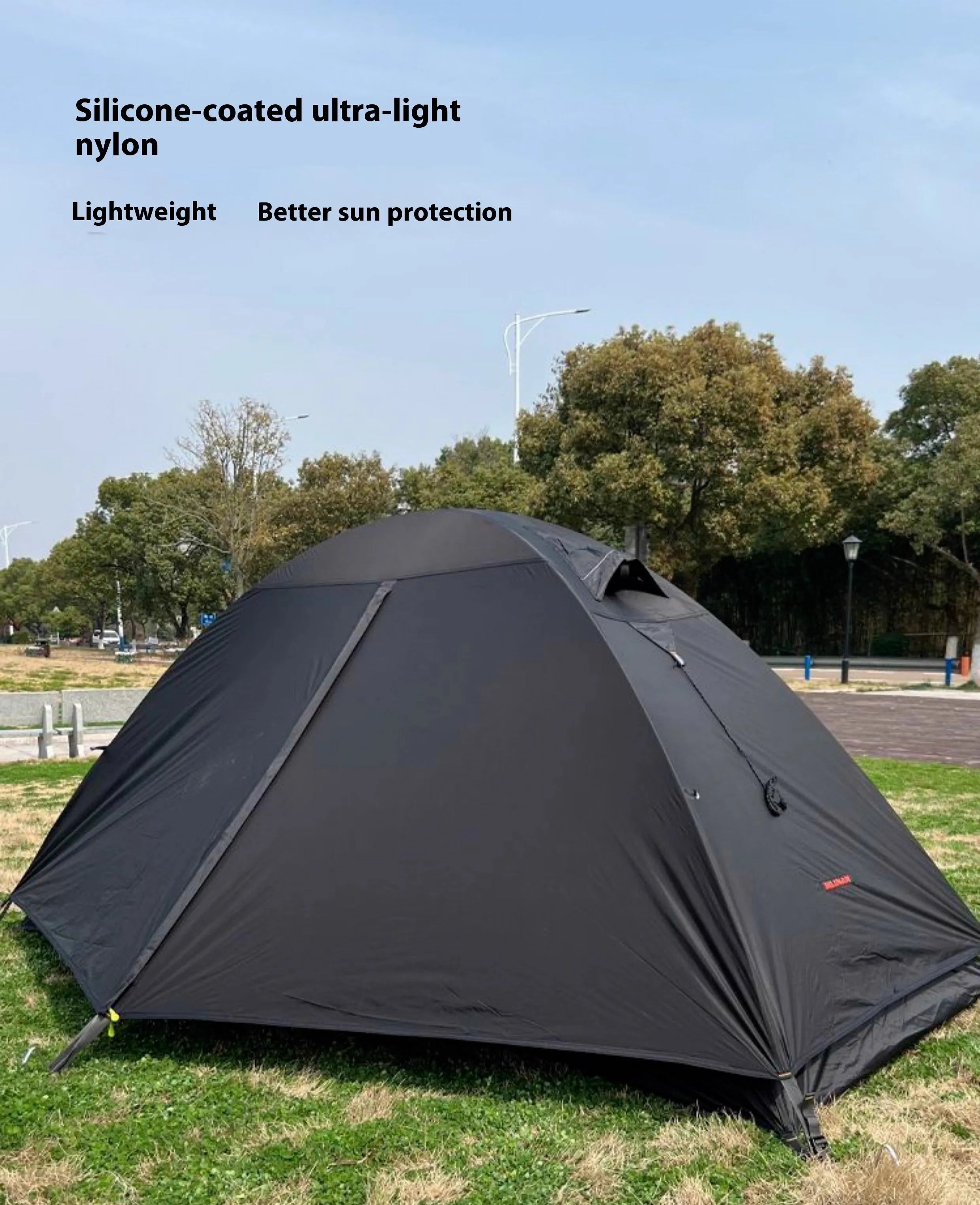 Single person tent with aluminum poles and silicon coated polyester outer layer in red black or orange
