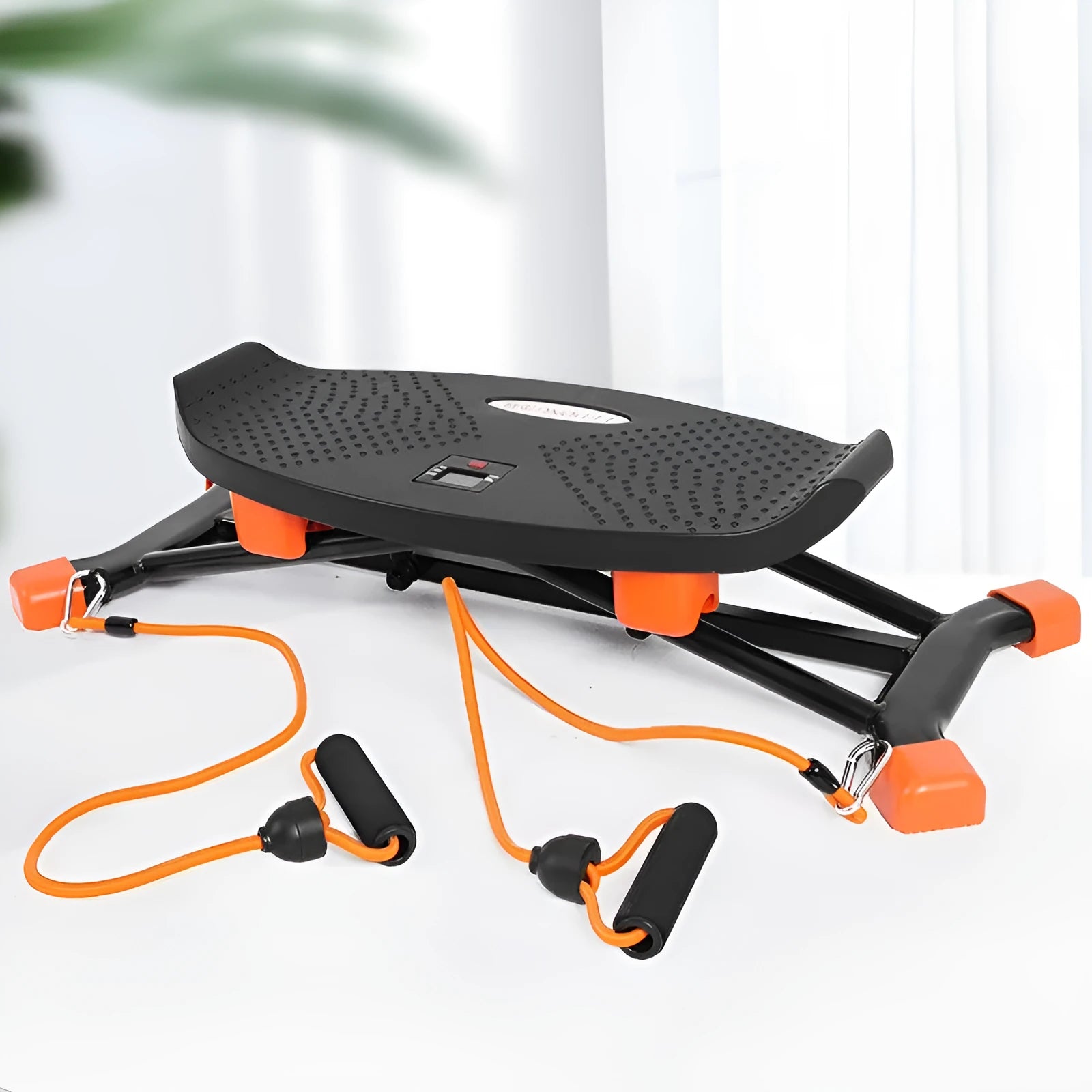 Black JS101A mini fitness skiing machine with elastic hand straps on a home floor