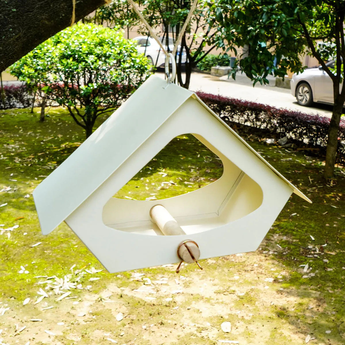 European-style iron bird nest with anti-rain roof in garden setting