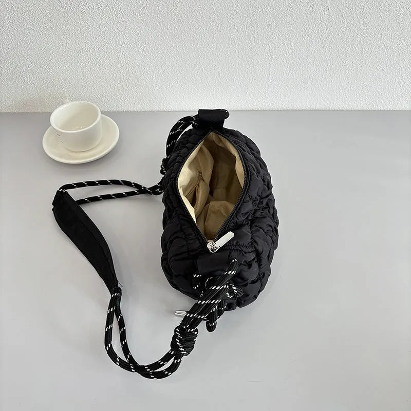 Women's lightweight nylon messenger bag in clouds print design with pillow shape and crossbody strap