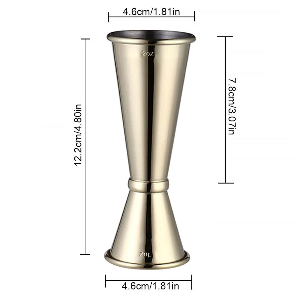 Double-headed stainless steel measuring cup and shaker on a bar counter for cocktail preparation