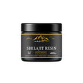 30g jar of pure Himalayan Shilajit resin with wooden measuring spoon on white background