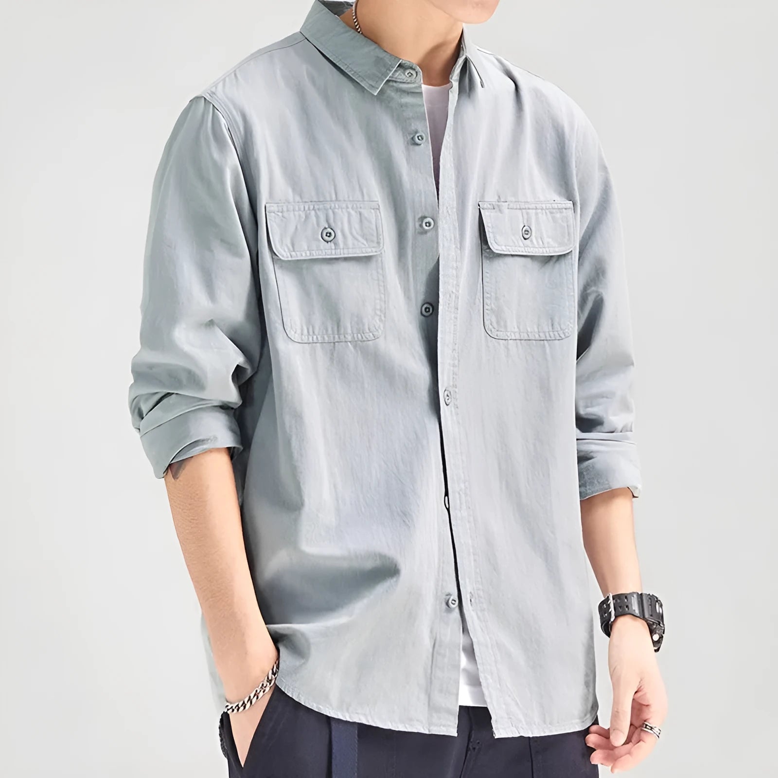 Men's light grey loose fit cardigan-style shirt with an overalls design and long sleeves.