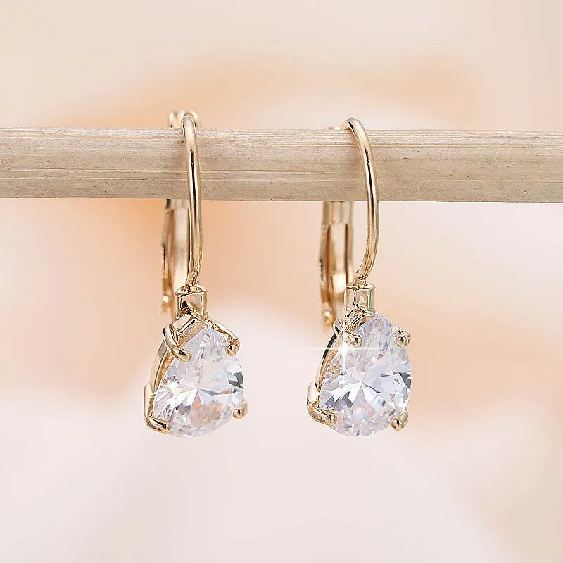 Gold and platinum coloured drop-shaped fashion earrings with metallic finish