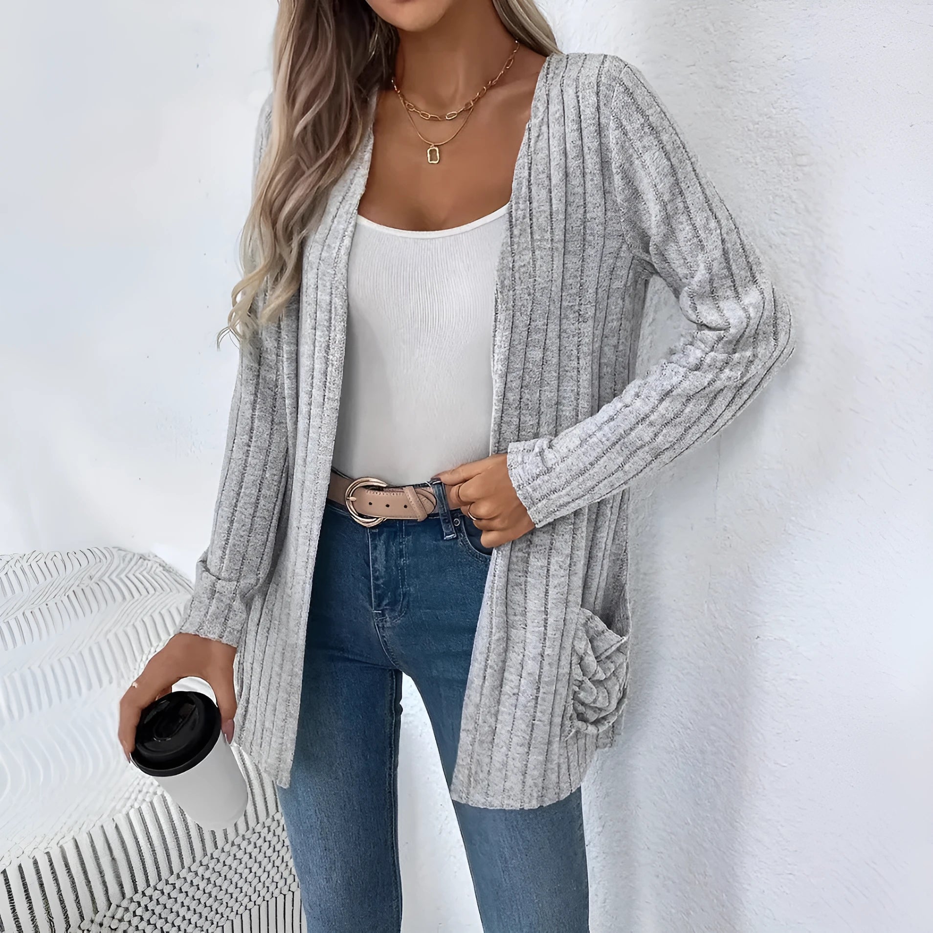 Solid colour loose fit long sleeve cardigan with front pocket in grey or black.