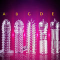 Crystal Exotic condom set with five transparent soft rubber dragon-themed sleeves in individual bags