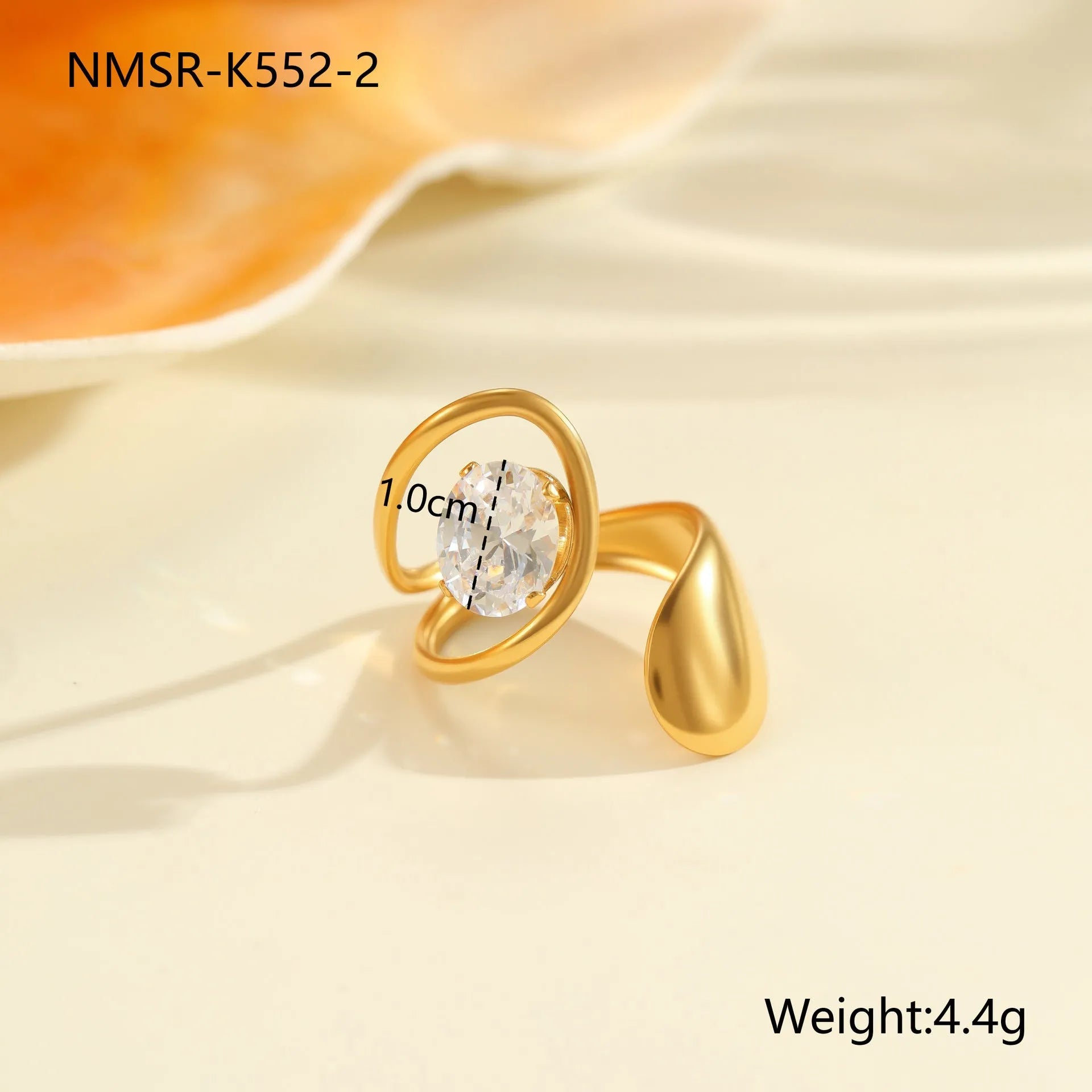 Geometric open mouth stainless steel zircon ring in a free size on a hand.