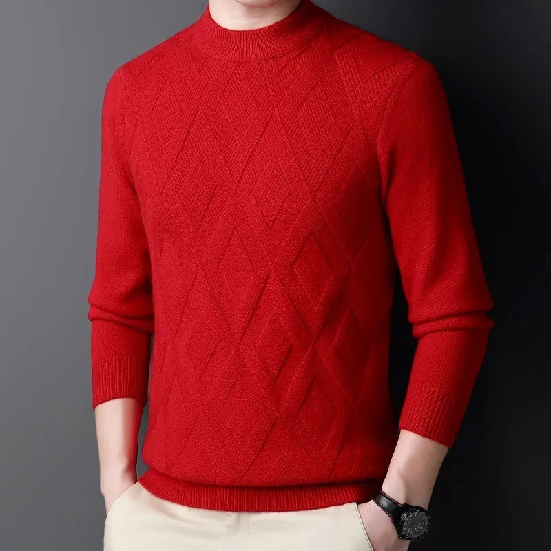 Man wearing a thick grey diamond jacquard knit pullover sweater.