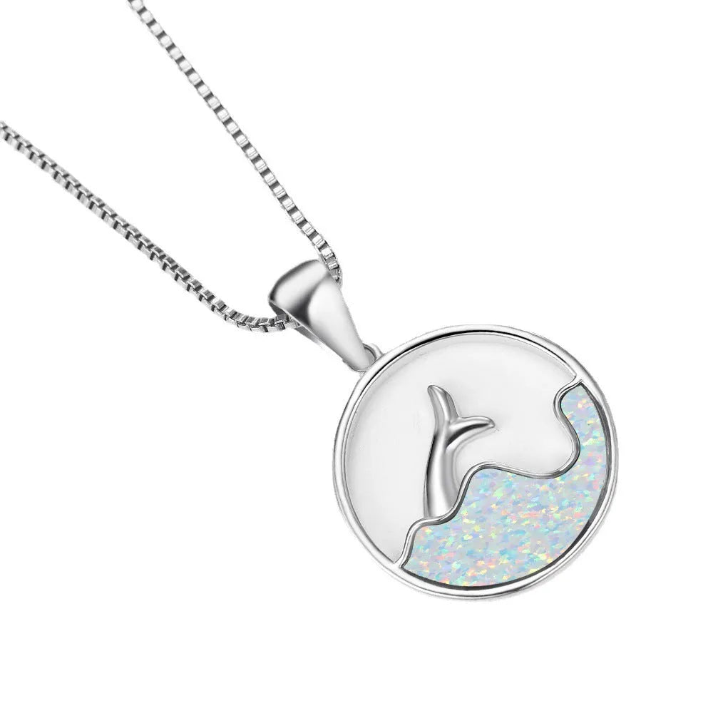 Geometric round fishtail pendant necklace with a blue opal stone on a chain, showing white gold electroplated finish.